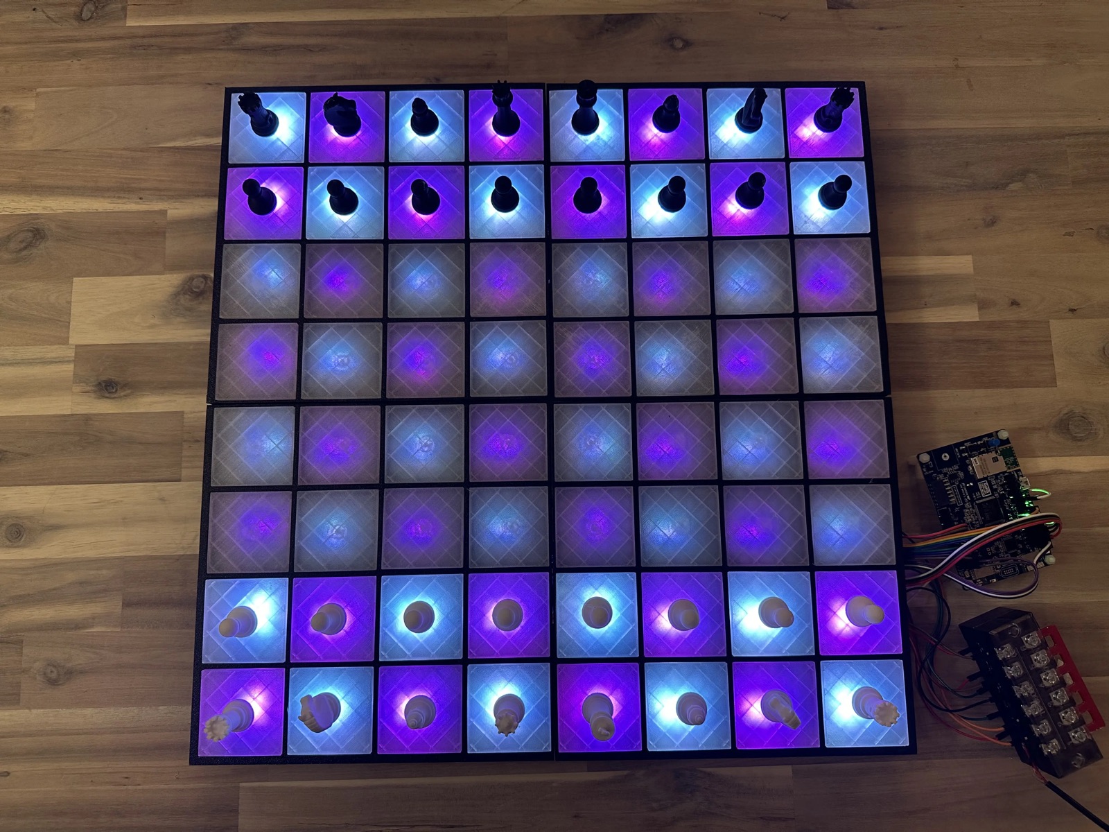 The finished embedded chessboard with LEDs lit