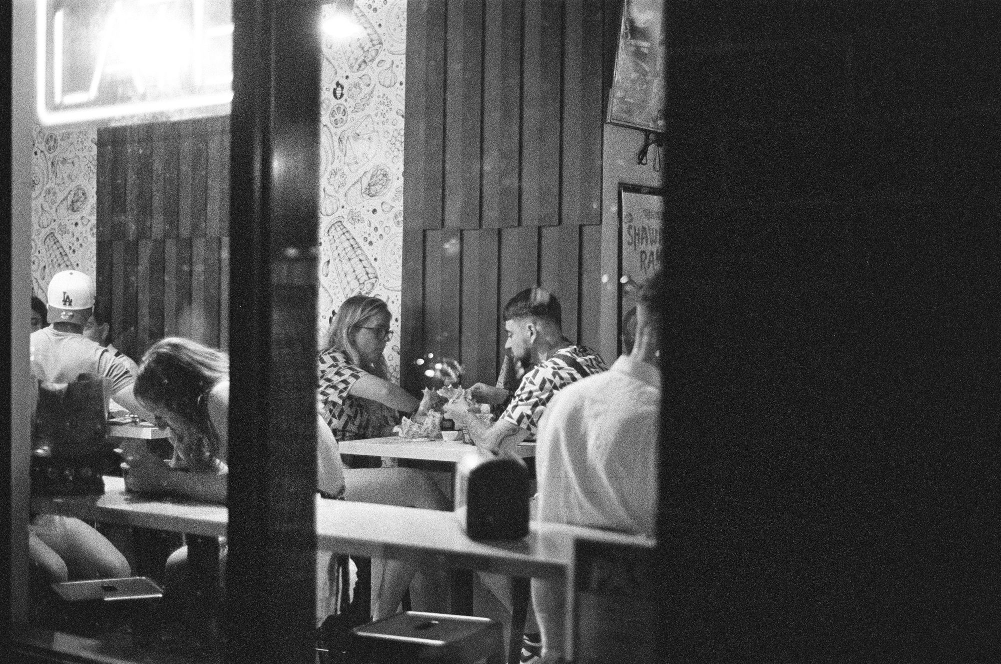 Diners seen through a restaurant window