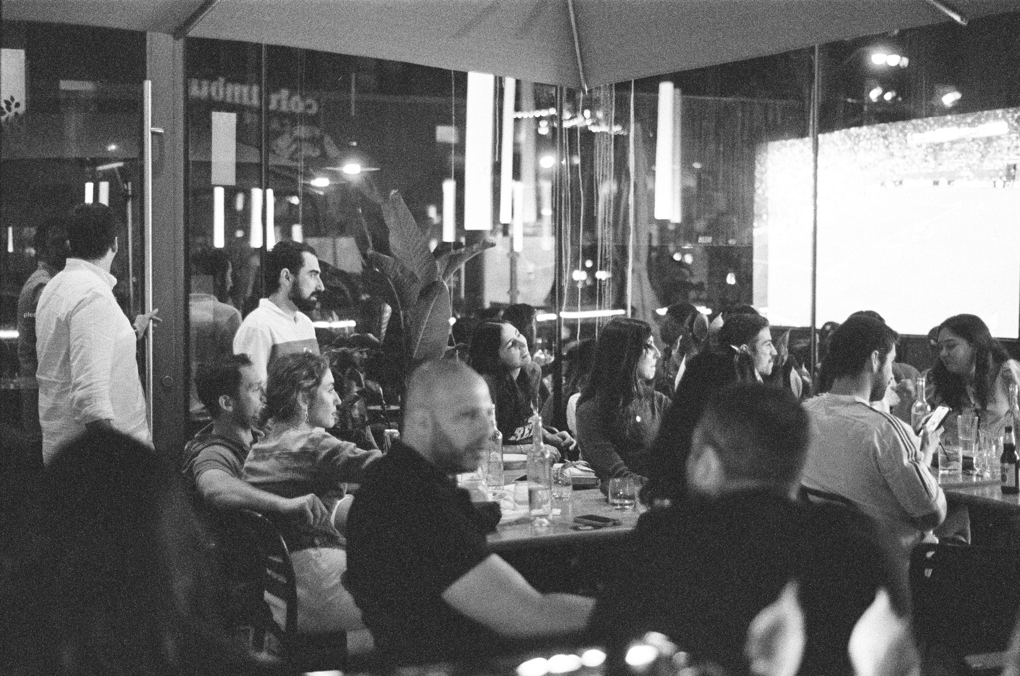 A crowded restaurant patio at night