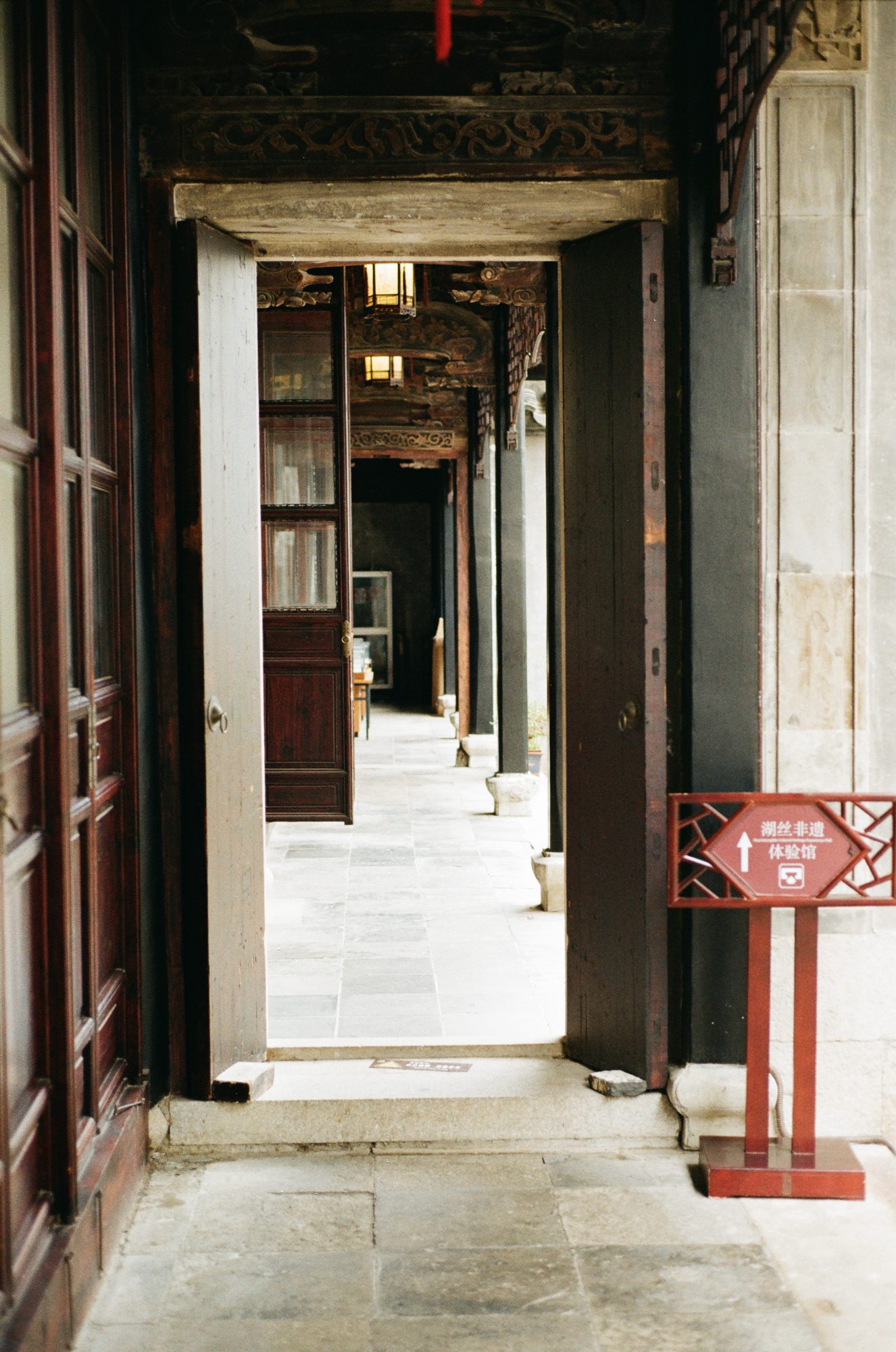 A succession of open doorways through an old house