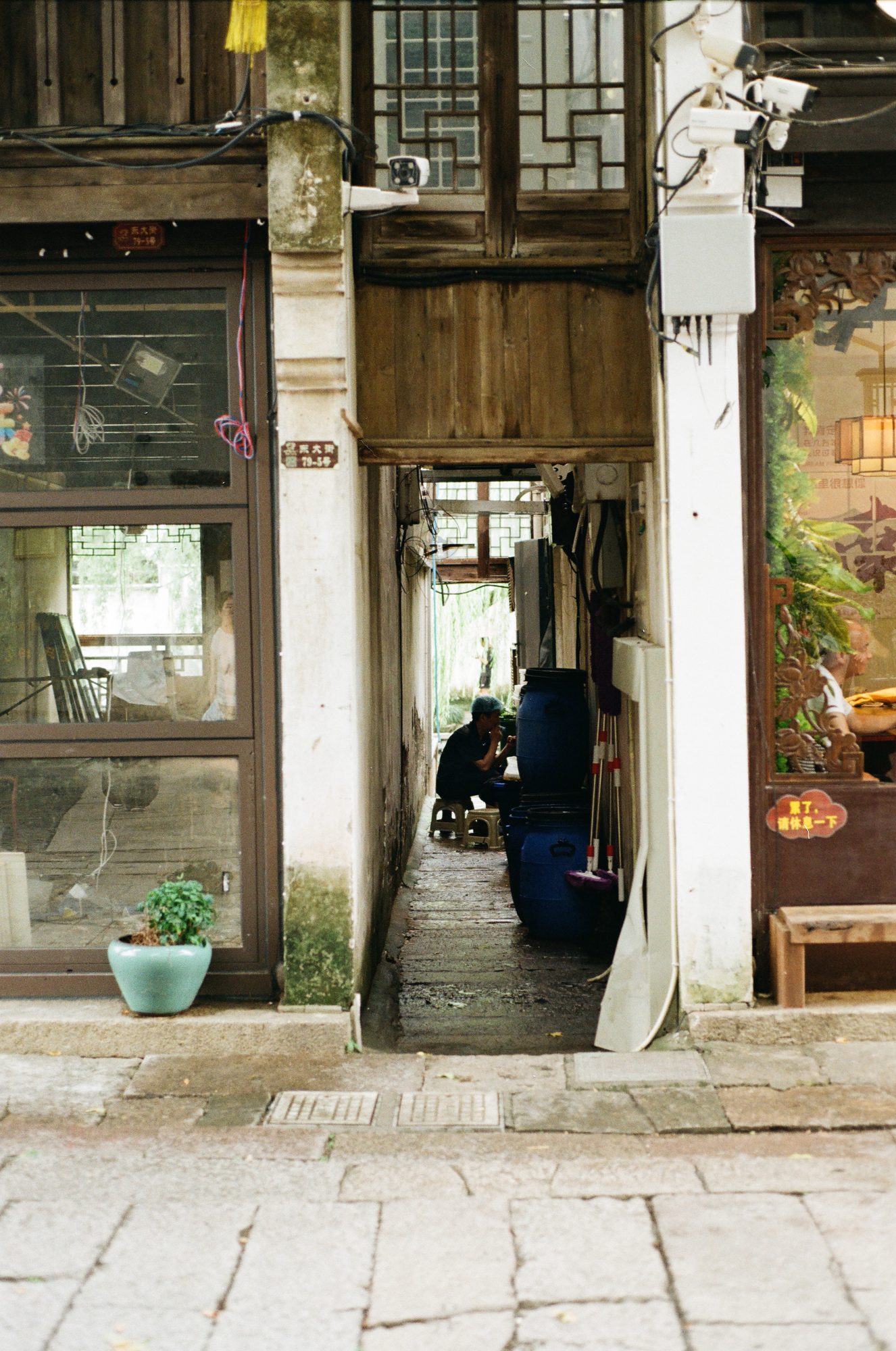 A doorway opening into a dim old shop
