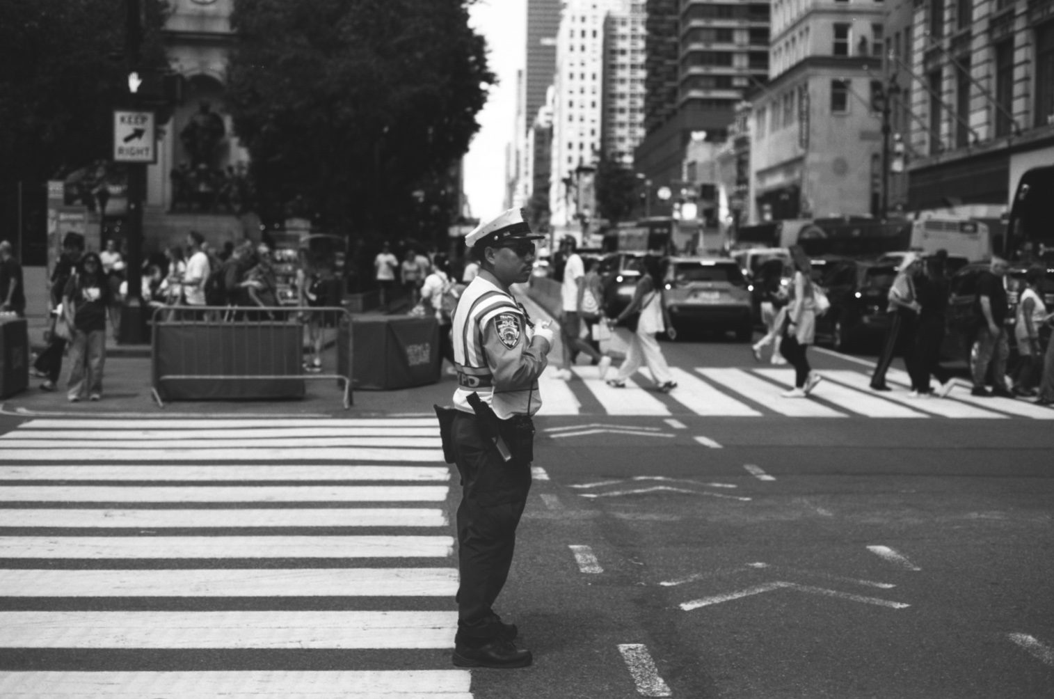 A traffic agent directing at a wide crosswalk