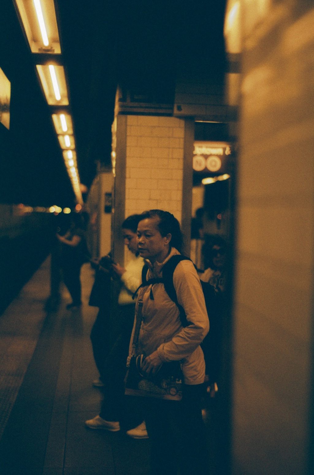 Commuters waiting on a subway platform