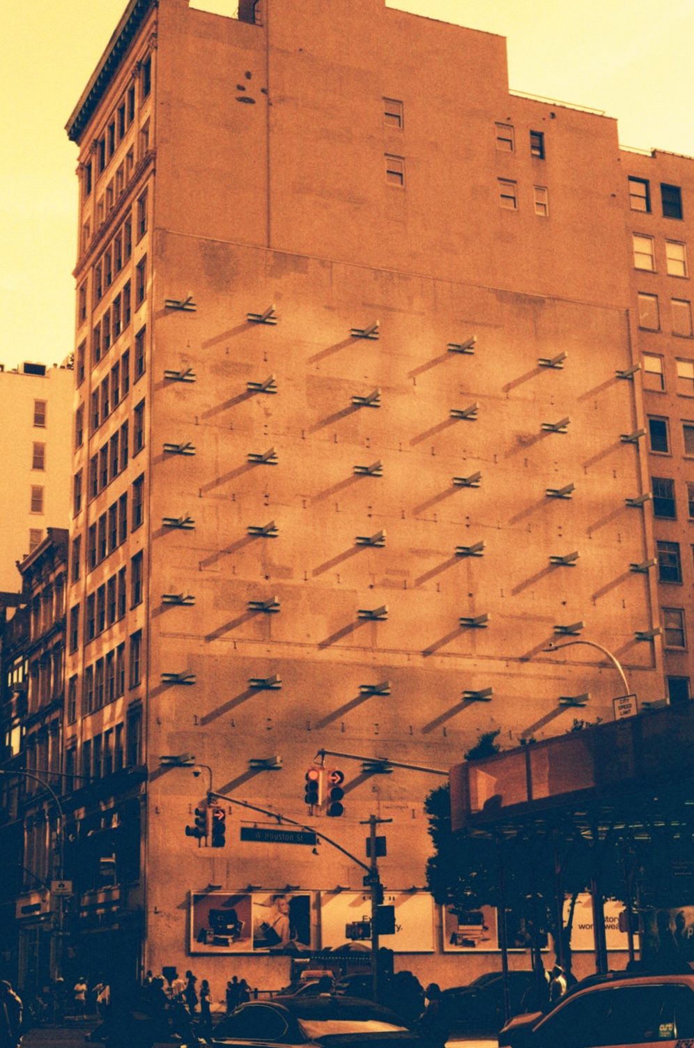 A tall brick wall burning orange in the last light